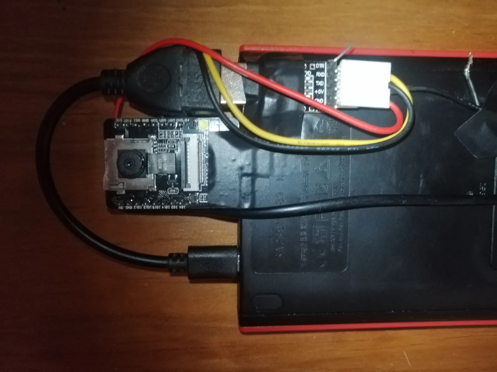 The ESP32-CAM rig wired to a battery pack